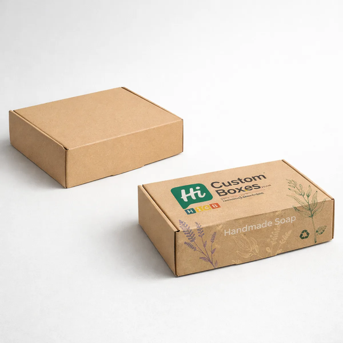 Two rectangular kraft paper mailing boxes, one plain and one printed with 
